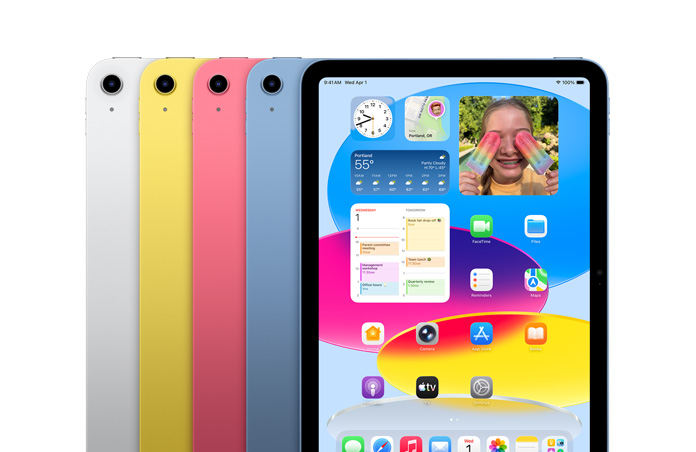 シルバー、イエロー、ピンク、ブルーの4色のiPadデバイスが並べられ、画面に壁紙と様々なアプリが表示されている