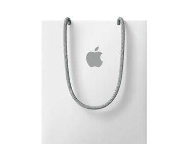 Bílá nákupní taška s logem Apple v horní části