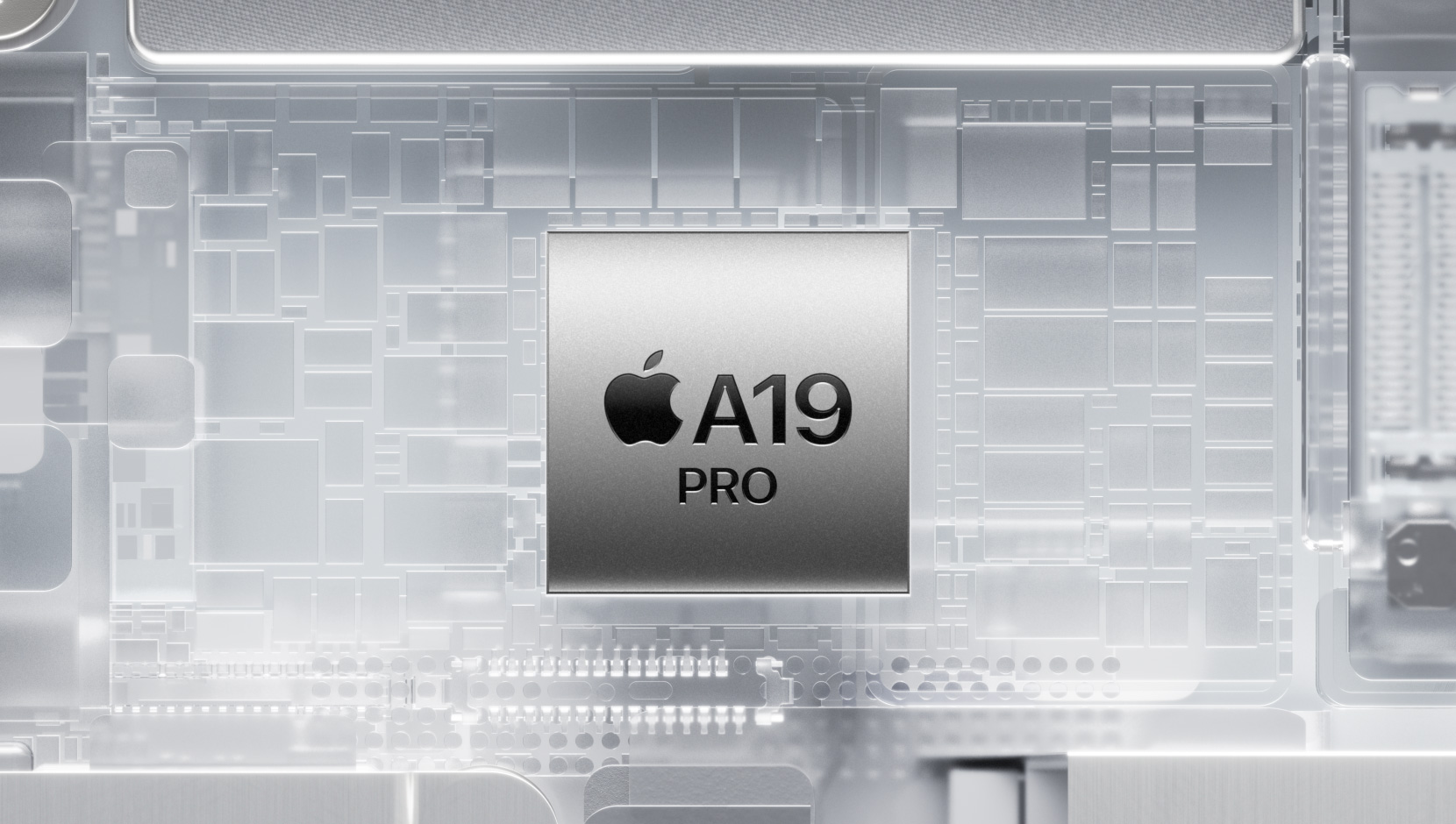 Czip A19 Pro otoczony przez mieniące się komponenty wewnętrzne iPhone’a